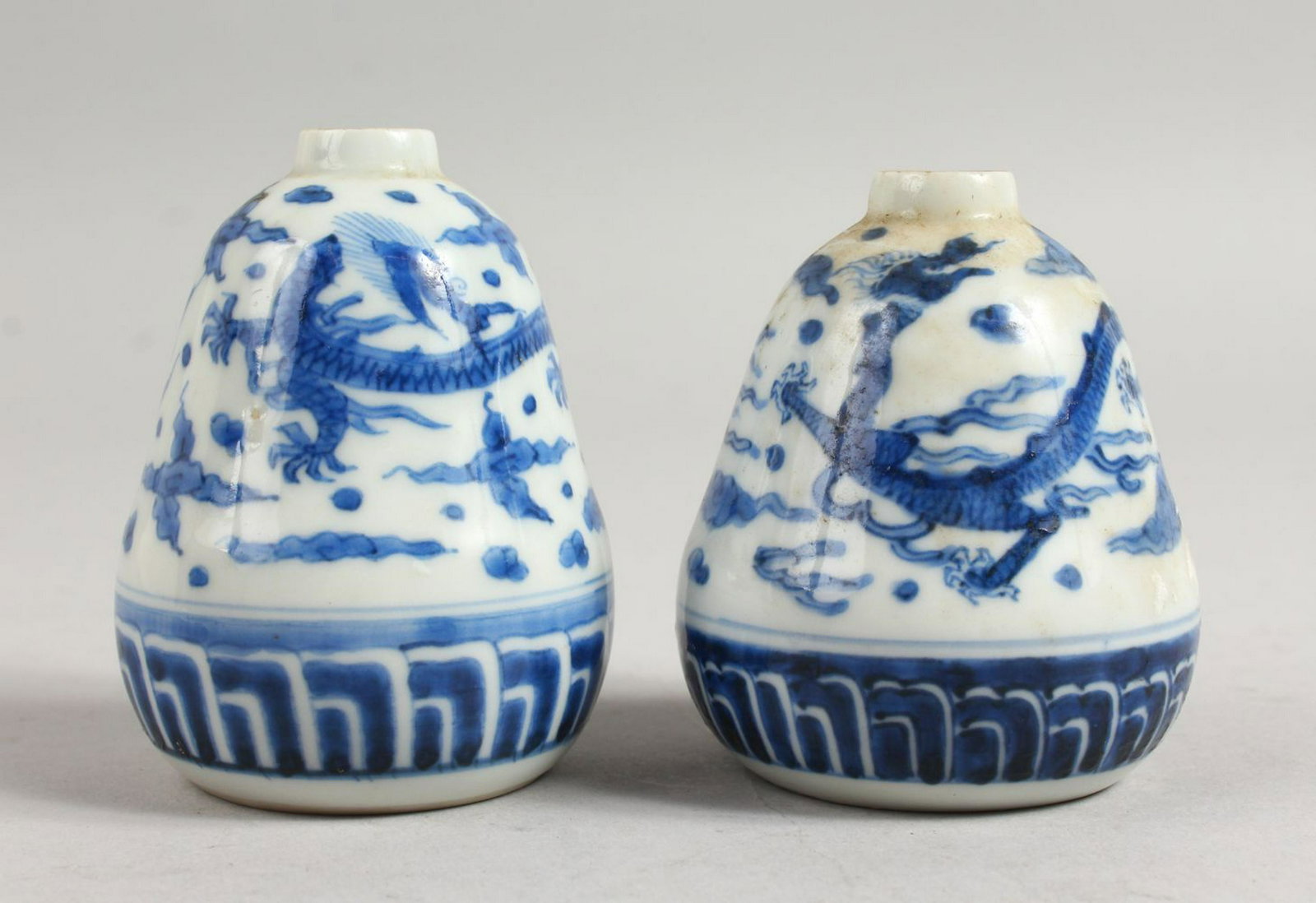A SMALL PAIR OF CHINESE BLUE AND WHITE VASES. 3.5ins: A SMALL PAIR OF CHINESE BLUE AND WHITE VASES. 3.5ins high.