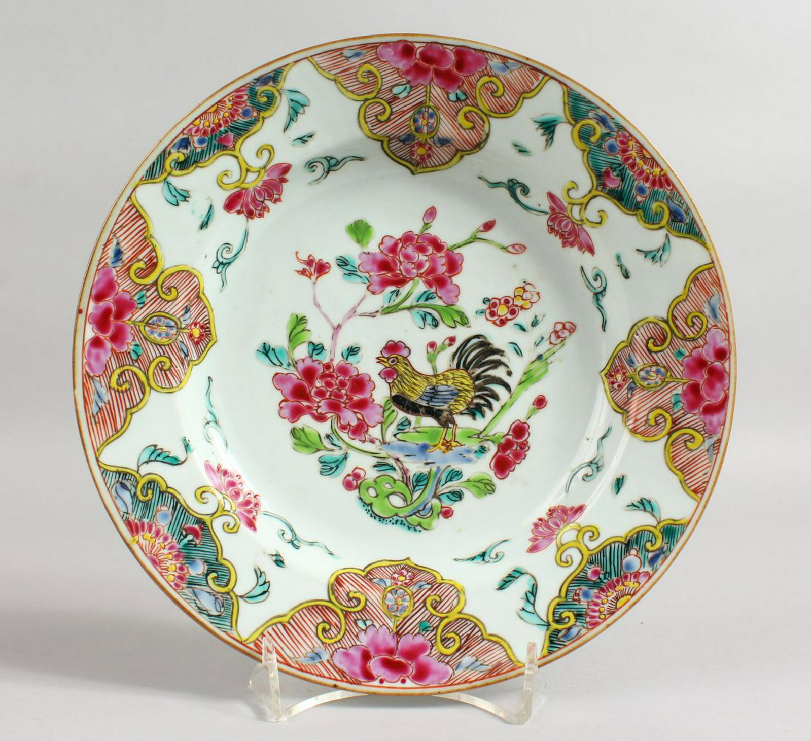 AN 18TH CENTURY CHINESE FAMILLE ROSE PLATE painted with: AN 18TH CENTURY CHINESE FAMILLE ROSE PLATE painted with flowers. 9ins diameter.