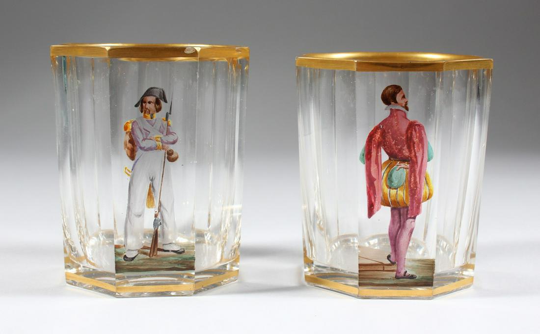 A PAIR OF AUSTRIAN CLEAR GLASS BEAKERS, each enamelled: A PAIR OF AUSTRIAN CLEAR GLASS BEAKERS, each enamelled with a male figure. 3.5ins high.