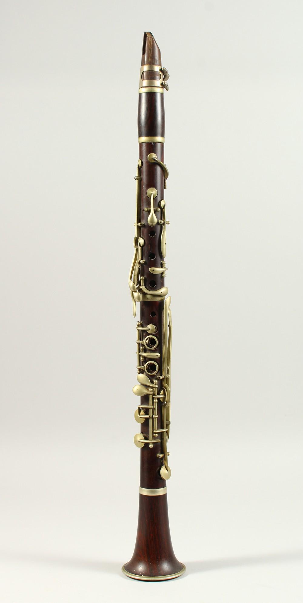 A WOODEN CLARINET. (AF) 63cms long.: A WOODEN CLARINET. (AF) 63cms long.