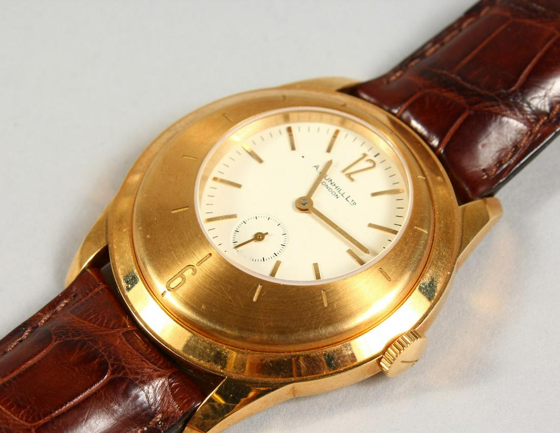 A HEAVY 18CT YELLOW GOLD DUNHILL OPEN BACK WRISTWATCH.: A HEAVY 18CT YELLOW GOLD DUNHILL OPEN BACK WRISTWATCH. Dunhill Ltd, London, with leather strap No. 115/250.