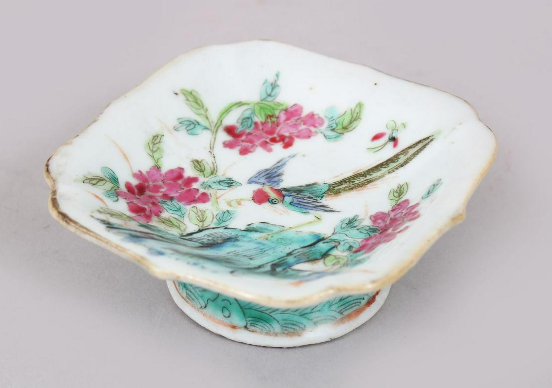 AN 19TH CENTURY CHINESE FAMILLE ROSE PORCELAIN SALT: AN 19TH CENTURY CHINESE FAMILLE ROSE PORCELAIN SALT CELLAR, decorated with scenes of a bird amongst native flora, the base with an iron red seal mark, 4cm high x 10.5 square.