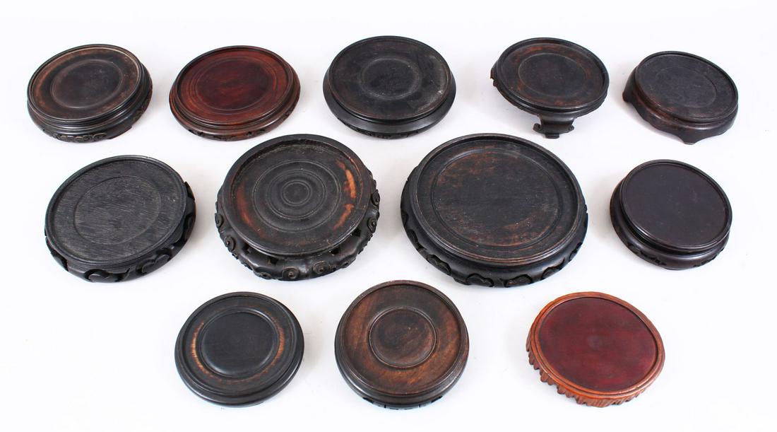 A MIXED LOT OF TWELVE CHINESE HARDWOOD STANDS, to fit (1 of 1)
