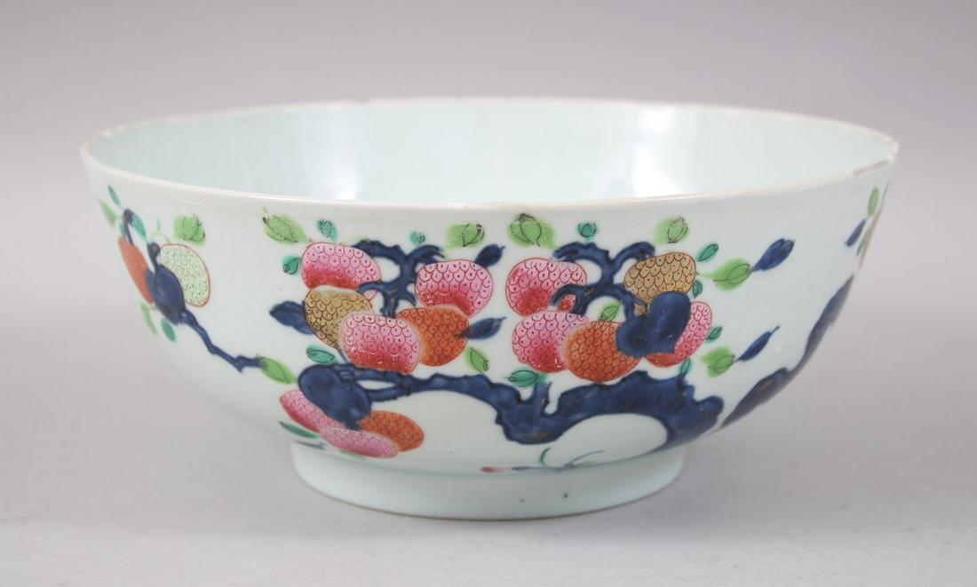 AN 18TH CENTURY CHINESE QIANLONG PERIOD FAMILLE ROSE: AN 18TH CENTURY CHINESE QIANLONG PERIOD FAMILLE ROSE BOWL, the exterior decorated with scenes of fruit trees, 24cm diameter x 9.5cm high.