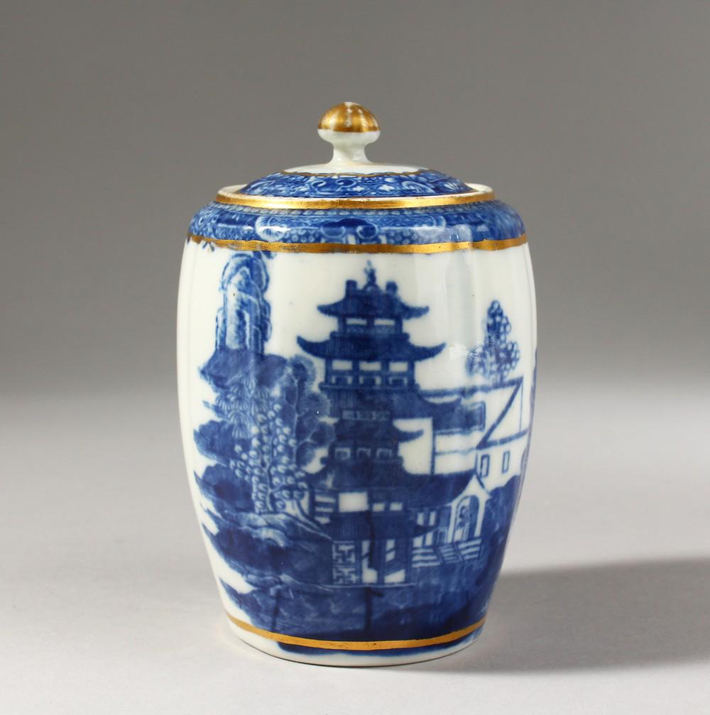 A CAUGHLEY BLUE AND WHITE TEA CANISTER AND COVER,: A CAUGHLEY BLUE AND WHITE TEA CANISTER AND COVER, decorated with a complex Oriental landscape, S mark to base.