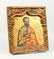 A 19TH CENTURY RUSSIAN ICON, depicting a saint, in a