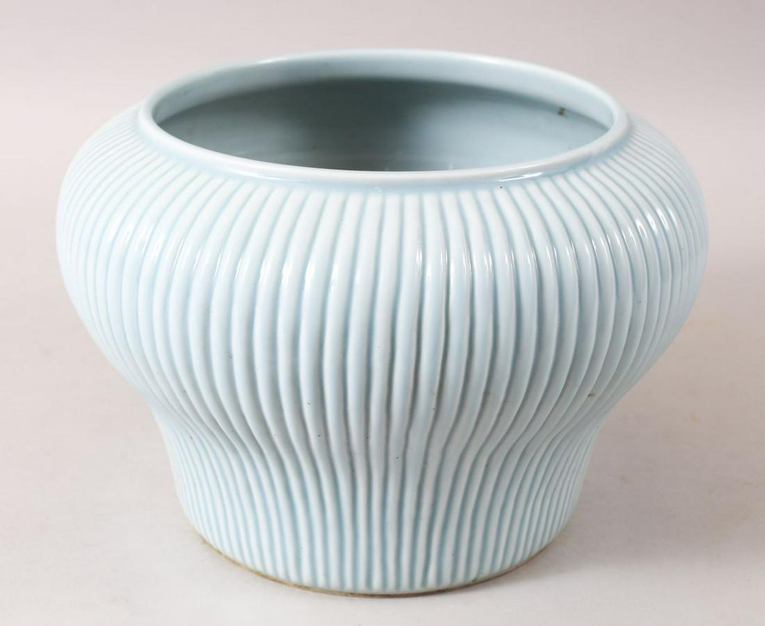 A GOOD CHINESE ROBINS EGG GROUND RIBBED PORCELAIN: A GOOD CHINESE ROBINS EGG GROUND RIBBED PORCELAIN JARDINERE, the body ribbed, the base unglazed, 17cm high x 16cm diameter.