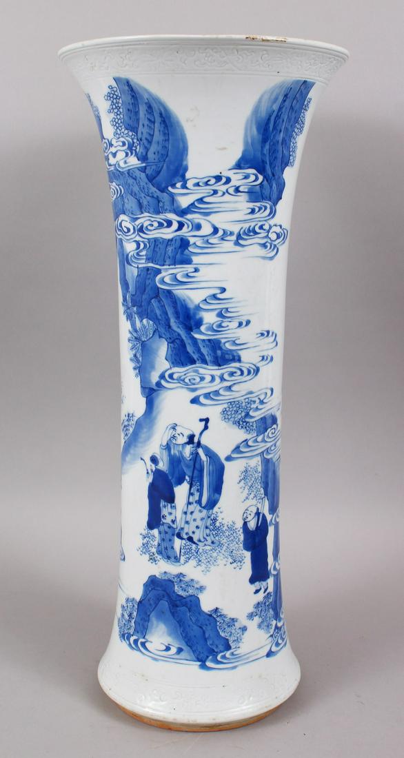 A GOOD 18TH / 19TH CENTURY CHINESE BLUE & WHITE: A GOOD 18TH / 19TH CENTURY CHINESE BLUE & WHITE TRANSITIONAL PORCELAIN VASE, the body depicting scenes of figures mountainside amongst clouds, the borders carved in formal scroll style, base unglazed 