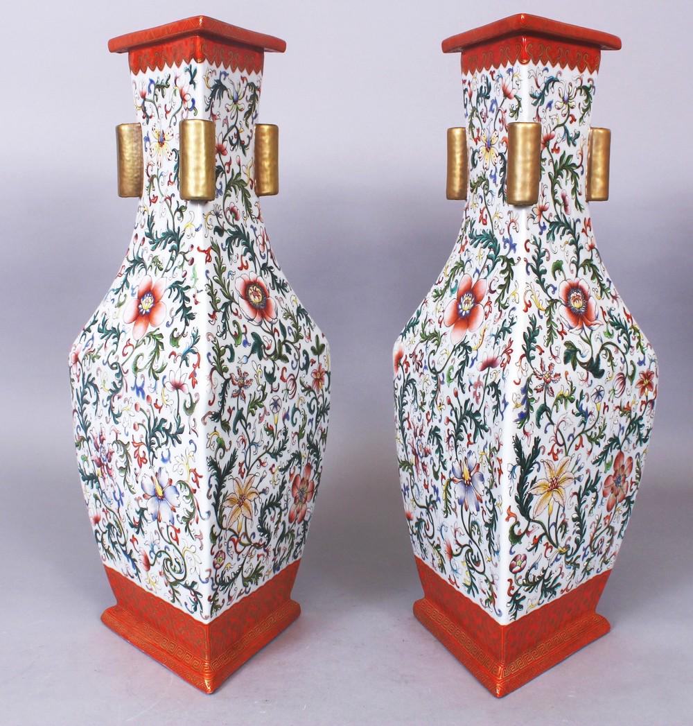 AN UNUSUAL PAIR OF GOOD QUALITY CHINESE FAMILLE ROSE: AN UNUSUAL PAIR OF GOOD QUALITY CHINESE FAMILLE ROSE TRIANGULAR SECTION PORCELAIN ARROW VASES, the sides of each well decorated with formal scrolling foliage, each base with a Qianlong seal mark, 38.7