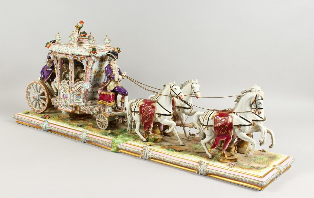 A LARGE 20TH CENTURY CONTINENTAL PORCELAIN MODEL OF A: A LARGE 20TH CENTURY CONTINENTAL PORCELAIN MODEL OF A COACH AND HORSES, in two parts, the coach with removable top. 36.5ins long x 8.5ins wide x 14.5ins high.
