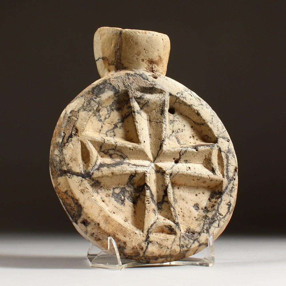 A BYZANTINE VEINED MARBLE MEDALLION, 6TH CENTURY. 9ins: A BYZANTINE VEINED MARBLE MEDALLION, 6TH CENTURY. 9ins long.