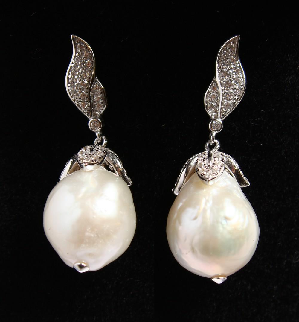 A PAIR OF SILVER BAROQUE PEARL EARRINGS.: A PAIR OF SILVER BAROQUE PEARL EARRINGS.