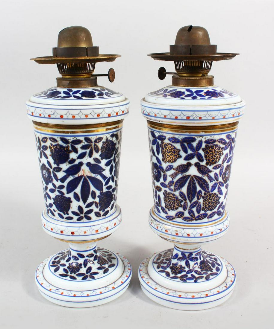 A GOOD PAIR OF BLUE AND WHITE QAJAR GLASS HOOKAH LAMP: A GOOD PAIR OF BLUE AND WHITE QAJAR GLASS HOOKAH LAMP BASES, 30cm high.