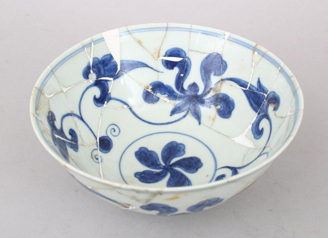 A GOOD CHINESE BLUE & WHITE PORCELAIN BOWL, the bowl: A GOOD CHINESE BLUE & WHITE PORCELAIN BOWL, the bowl with lotus decoration, completely repaired, 15.5cm diameter x 7cm high.