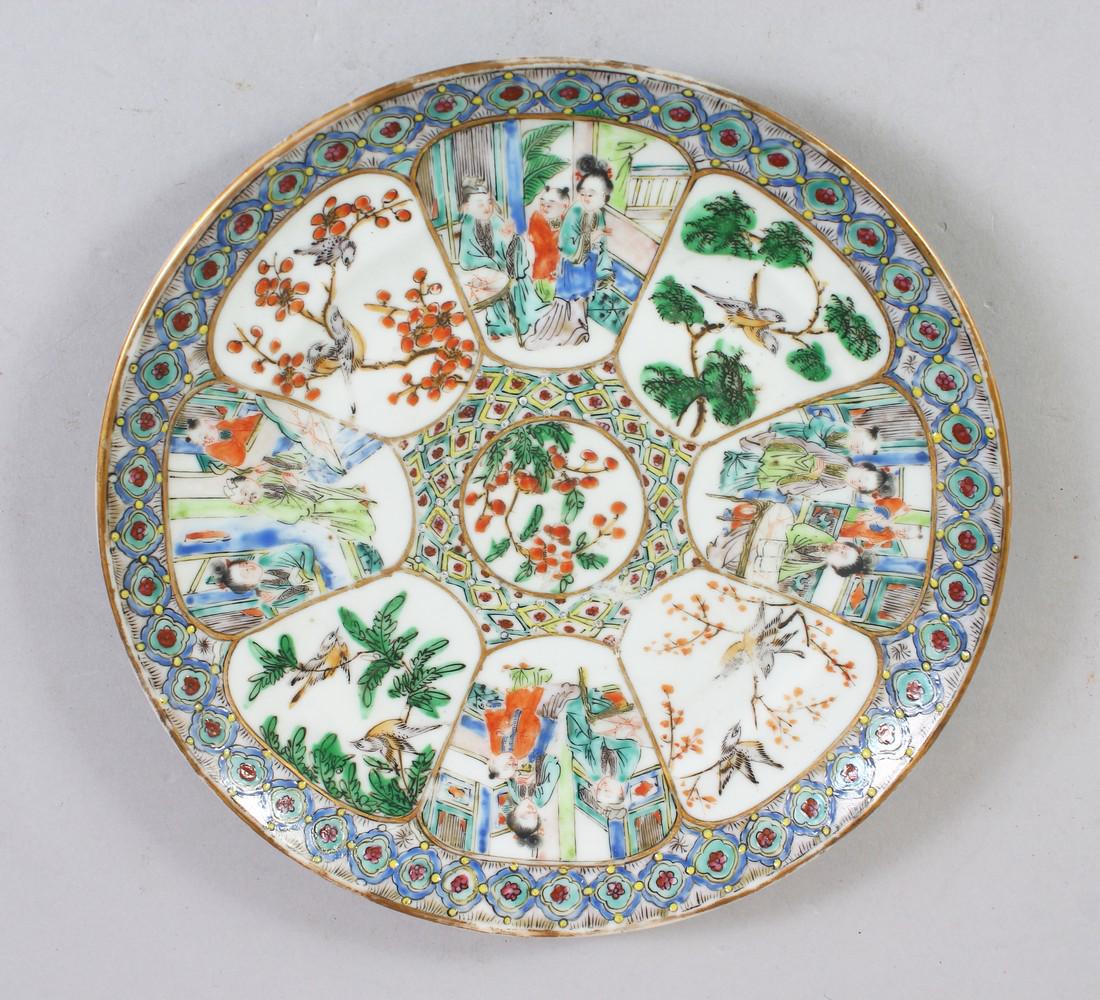 A GOOD CHINESE FAMILLE ROSE PORCELAIN DISH, decorated: A GOOD CHINESE FAMILLE ROSE PORCELAIN DISH, decorated with panels of alternating figures in landscapes and birds amongst trees, 20.5cm diameter.
