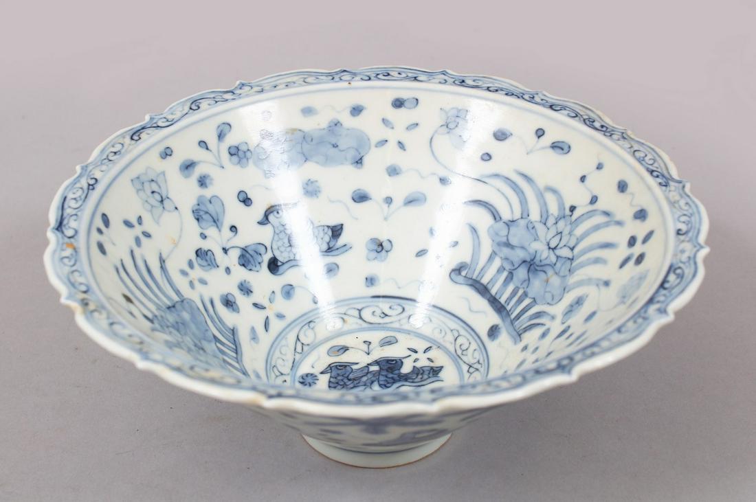 A GOOD CHINESE MING STYLE BLUE & WHITE PORCELAIN BOWL,: A GOOD CHINESE MING STYLE BLUE & WHITE PORCELAIN BOWL, decorated with scenes of ducks / geese amongst native formal flora, 7.5cm high x 18.5cm.