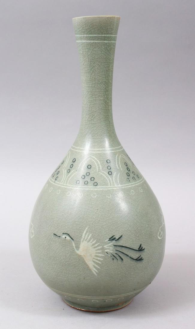 A GOOD CHINESE / KOREAN CELADON GROUND CRACKLE GLAZE: A GOOD CHINESE / KOREAN CELADON GROUND CRACKLE GLAZE PORCELAIN VASE, the body decorated with scenes of flying birds & stylized clouds, 27cm high.