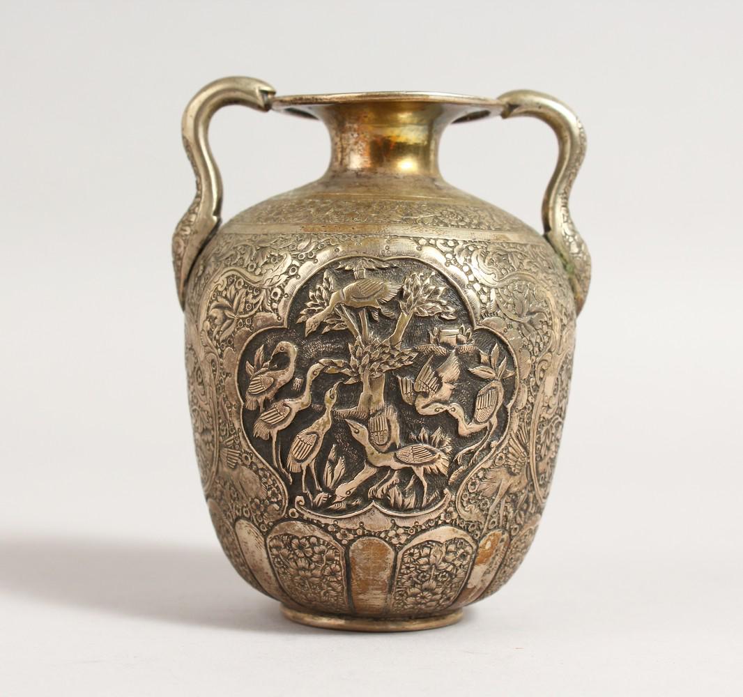 A JAPANESE SILVER TWO HANDLED URN SHAPED VASE decorated: A JAPANESE SILVER TWO HANDLED URN SHAPED VASE decorated with cranes. 4ins high.