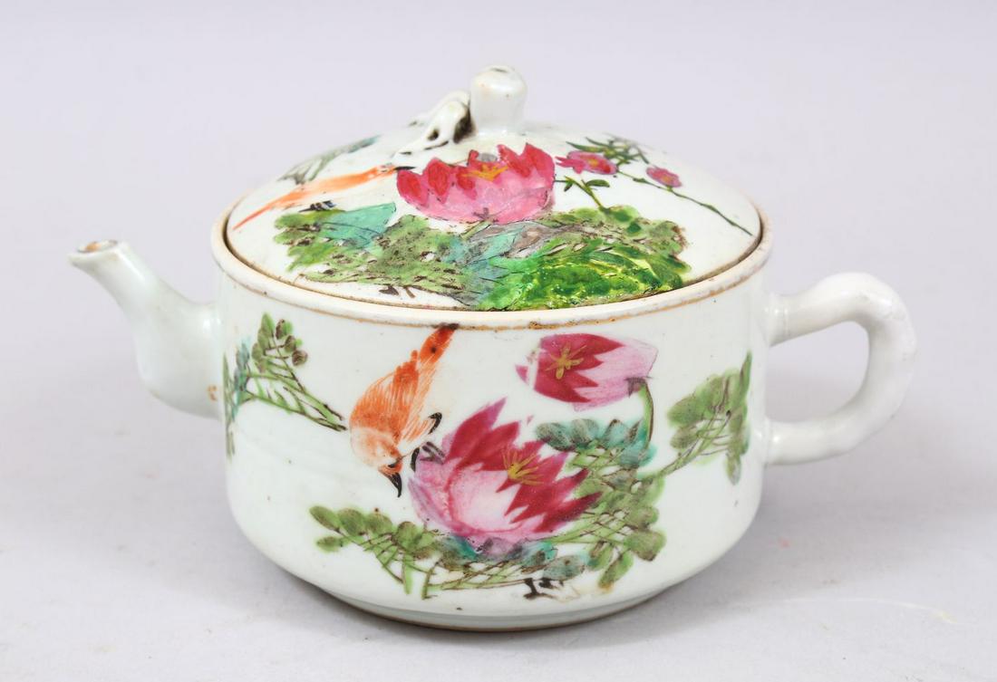 A 19TH / 20TH CENTURY CHINESE FAMILLE ROSE PORCELAIN: A 19TH / 20TH CENTURY CHINESE FAMILLE ROSE PORCELAIN TEA POT, the body of the pot decorated with scenes of birds amongst native flora, the base bearing a four character mark, 9.5cm high x 17cm wide in