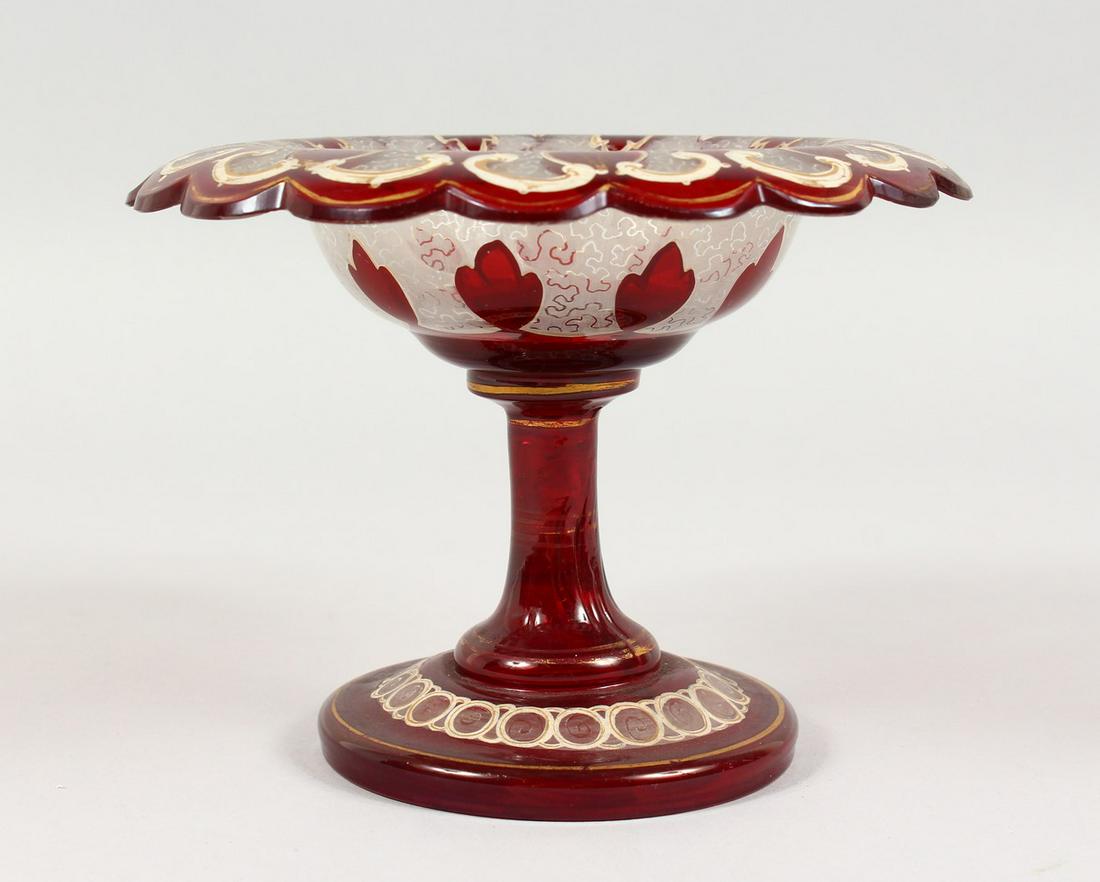 A BOHEMIAN RUBY GLASS TAZZA, with gilt decoration.: A BOHEMIAN RUBY GLASS TAZZA, with gilt decoration. 6.5ins diameter.