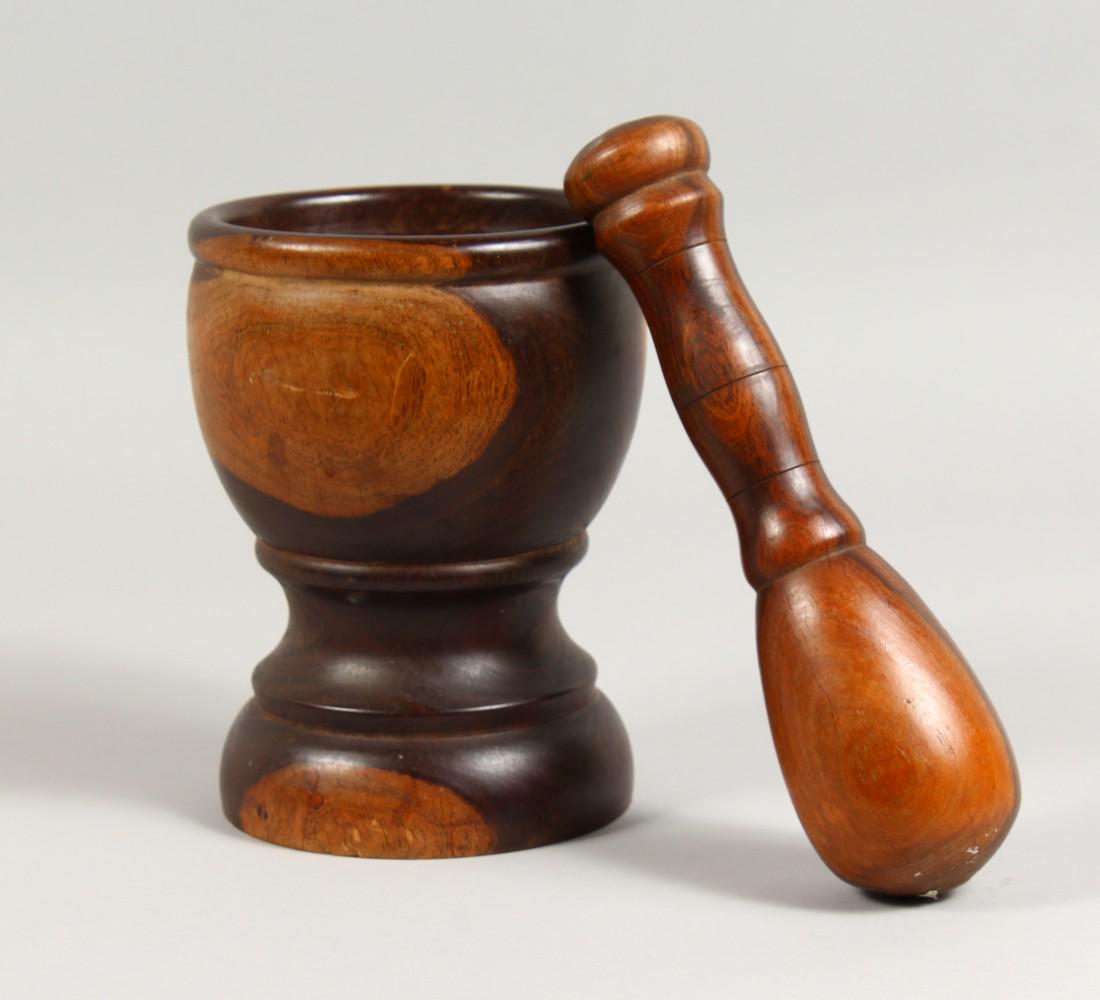 A 19TH CENTURY LIGNUM VITAE PESTLE AND MORTAR. Mortar:: A 19TH CENTURY LIGNUM VITAE PESTLE AND MORTAR. Mortar: 7ins high.