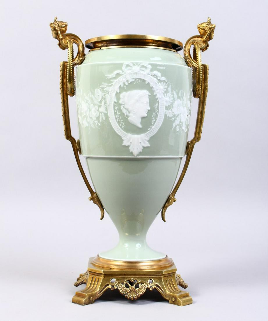 A GOOD 19TH CENTURY FRENCH PATE-SUR-PATE TWO-HANDLED: A GOOD 19TH CENTURY FRENCH PATE-SUR-PATE TWO-HANDLED URN, with ormolu mount inset with a portrait. 14ins high.
