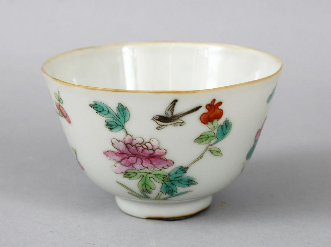 A 19TH CENTURY CHINESE FAMILLE ROSE PORCELAIN CUP, the: A 19TH CENTURY CHINESE FAMILLE ROSE PORCELAIN CUP, the cup decorated with scenes of birds and flora, the base with an iron red seal mark, 8.5cm diameter x 5cm high.