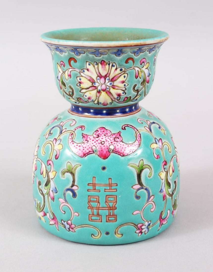 A GOOD 20TH CENTURY CHINESE TURQUOISE GROUND FAMILLE: A GOOD 20TH CENTURY CHINESE TURQUOISE GROUND FAMILLE ROSE PORCELAIN BRUSH WASH, decorated with bats peace symbols and native flora, the base with a six character iron red daoguang mark, 10cm high x 8c