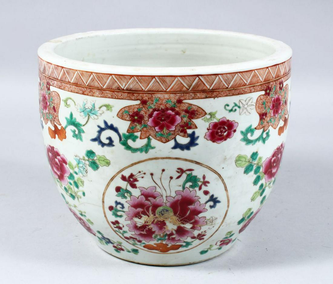 A GOOD 19TH CENTURY CHINESE FAMILLE ROSE PORCELAIN: A GOOD 19TH CENTURY CHINESE FAMILLE ROSE PORCELAIN JARDINIERE, decorated with roundels of floral display amongst native flora, 20cm high x 24.5cm diameter.