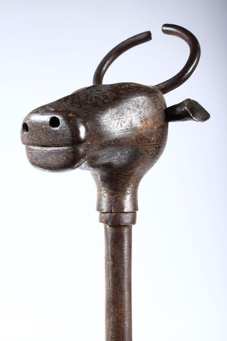 A QAJAR STEEL MACE MODELLED AS AN OX HEAD, 72cm long.: A QAJAR STEEL MACE MODELLED AS AN OX HEAD, 72cm long.