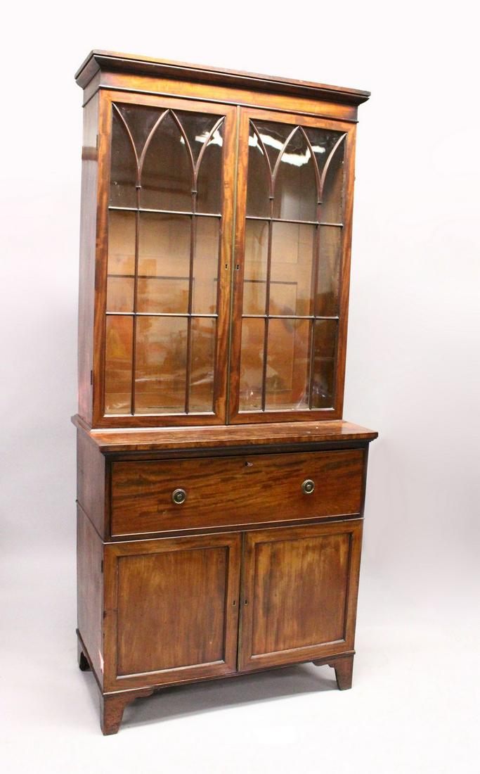 A GEORGE III MAHOGANY SECRETAIRE CUPBOARD BOOKCASE,: A GEORGE III MAHOGANY SECRETAIRE CUPBOARD BOOKCASE, with moulded cornice, pair of astragal glazed doors enclosing three adjustable shelves, a deep secretaire drawer over a pair of panelled cupboard do