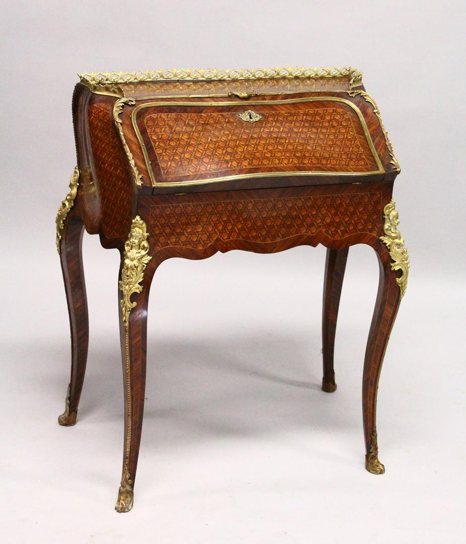 A GOOD LOUIS XVI DESIGN KINGWOOD, ROSEWOOD AND ORMOLU: A GOOD LOUIS XVI DESIGN KINGWOOD, ROSEWOOD AND ORMOLU PARQUETRY BUREAU DE DAME, with galleried top, fall front, on cabriole legs, with rich ormolu mounts. 2ft 5ins wide x 2ft 10ins high x 1ft 5ins dee