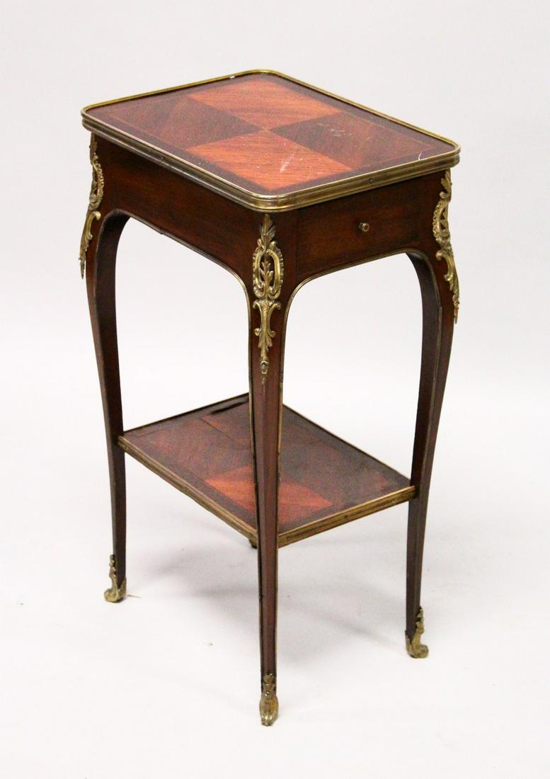 A SMALL LATE 19TH CENTURY FRENCH MAHOGANY AND ORMOLU: A SMALL LATE 19TH CENTURY FRENCH MAHOGANY AND ORMOLU TABLE, with a drawer to one end, on slender cabriole legs united by an undertier. 1ft 4ins wide x 2ft 4ins high x 1ft 0ins deep.