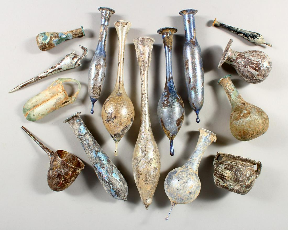 A COLLECTION OF FIFTEEN ROMAN-TYPE DECORATIVE GLASS: A COLLECTION OF FIFTEEN ROMAN-TYPE DECORATIVE GLASS VESSELS.