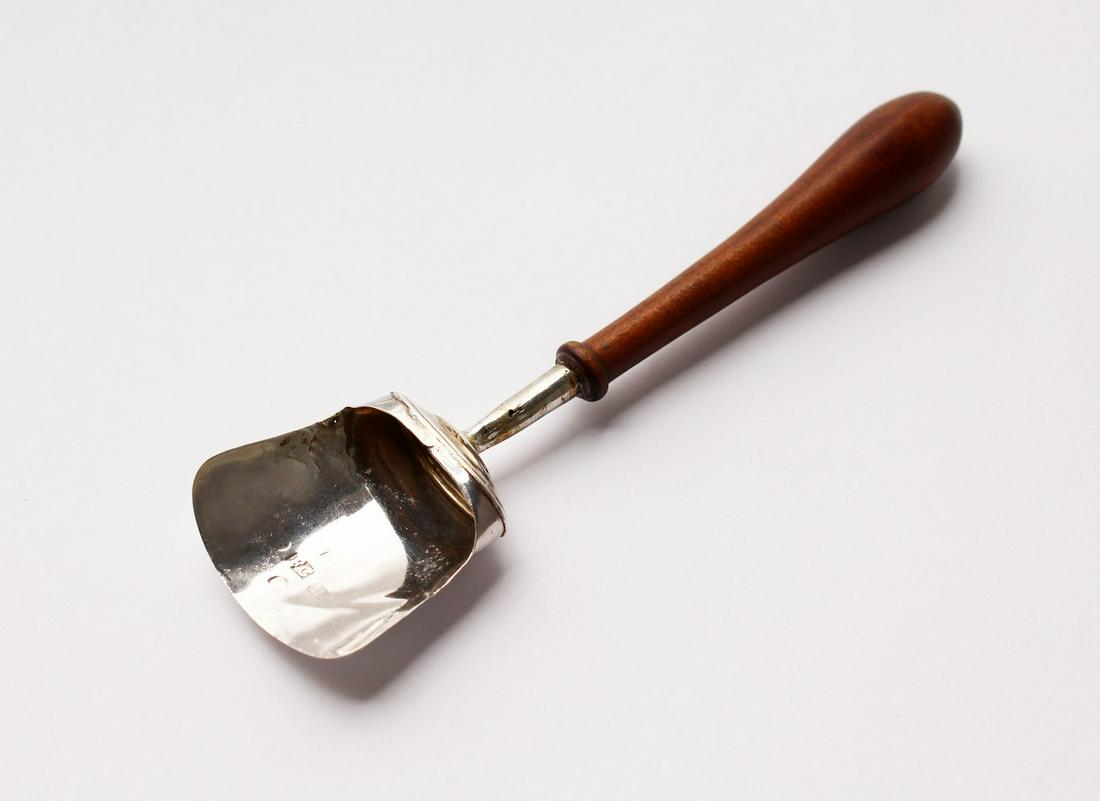 A VICTORIAN CADDY SHOVEL, with turned wood handle.: A VICTORIAN CADDY SHOVEL, with turned wood handle. Birmingham 1840. Maker: Francis Clark.