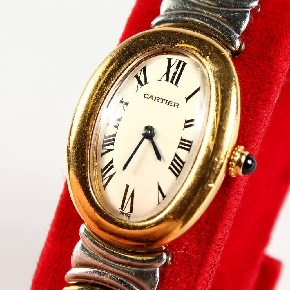 A CARTIER GOLD AND STEEL WRISTWATCH: A CARTIER GOLD AND STEEL WRISTWATCH, in red Cartier pouch.