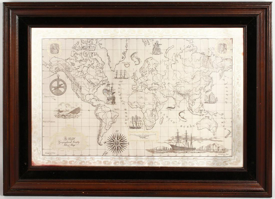 A FRAMED SILVER AND 24CT GOLD MAP OF THE WORLD.: A FRAMED SILVER AND 24CT GOLD MAP OF THE WORLD.
