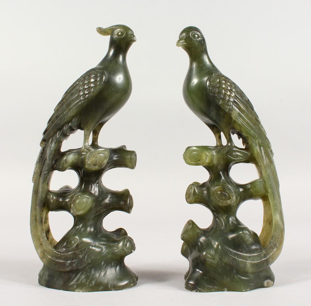 A GOOD PAIR OF CHINESE CARVED PEACOCKS: A GOOD PAIR OF CHINESE CARVED JADEITE / NEPHRITE PEACOCKS. 8.5ins high.