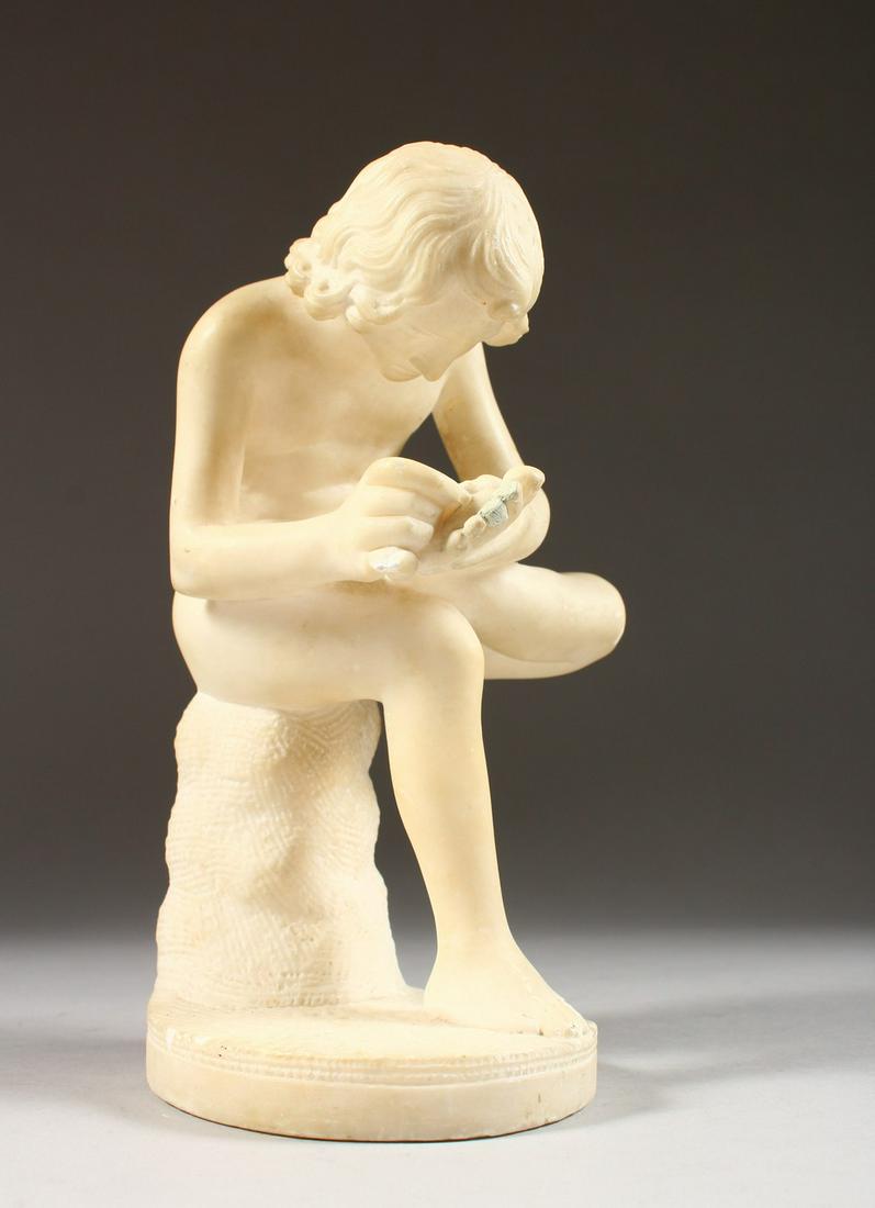 A CARVED ALABASTER FIGURE, a young man removing a thorn: A CARVED ALABASTER FIGURE, a young man removing a thorn from his foot. 8.5ins high.