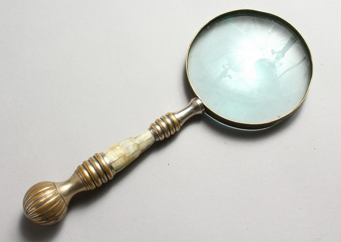 A MAGNIFYING GLASS, with mother-of-pearl handle.: A MAGNIFYING GLASS, with mother-of-pearl handle.