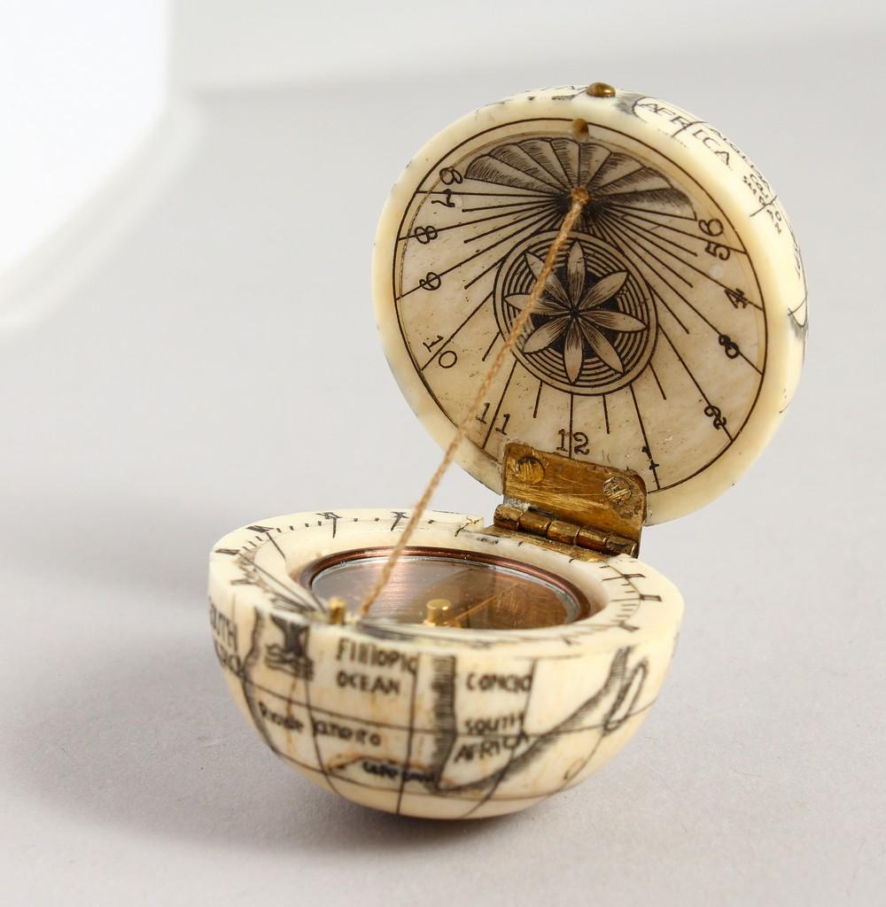 AN ENGRAVED BONE COMPASS GLOBE.: AN ENGRAVED BONE COMPASS GLOBE.