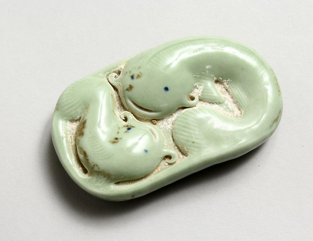 A CHINESE CARVED DOLPHIN SCROLL WEIGHT.: A CHINESE CARVED DOLPHIN SCROLL WEIGHT.