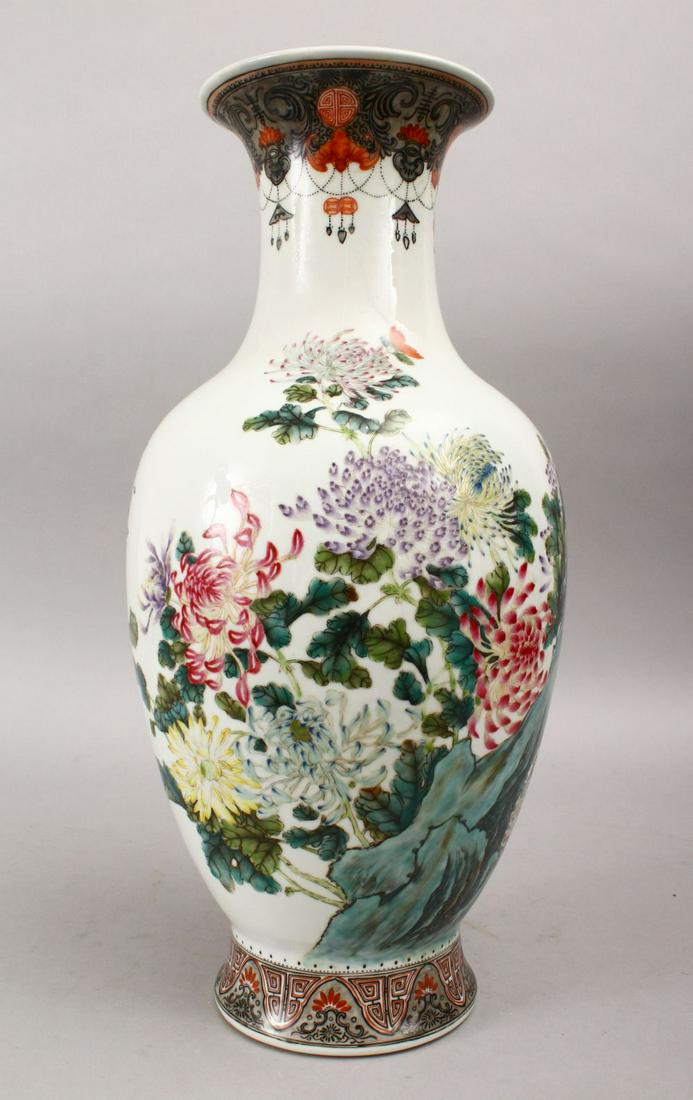 A GOOD CHINESE REPUBLIC PERIOD FAMILLE ROSE PORCELAIN: A GOOD CHINESE REPUBLIC PERIOD FAMILLE ROSE PORCELAIN VASE, the body of the vase decorate with scenes of a landscape with native floral spray, the neck with finely decorated hanging decoration with ba