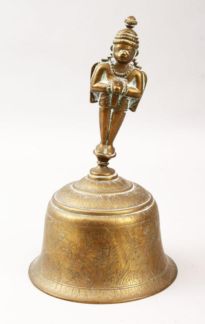 AN INDIAN BRASS GHANTI/BELL, the body engraved with: AN INDIAN BRASS GHANTI/BELL, the body engraved with animals, 23.5cm high, bell 14cm diameter.