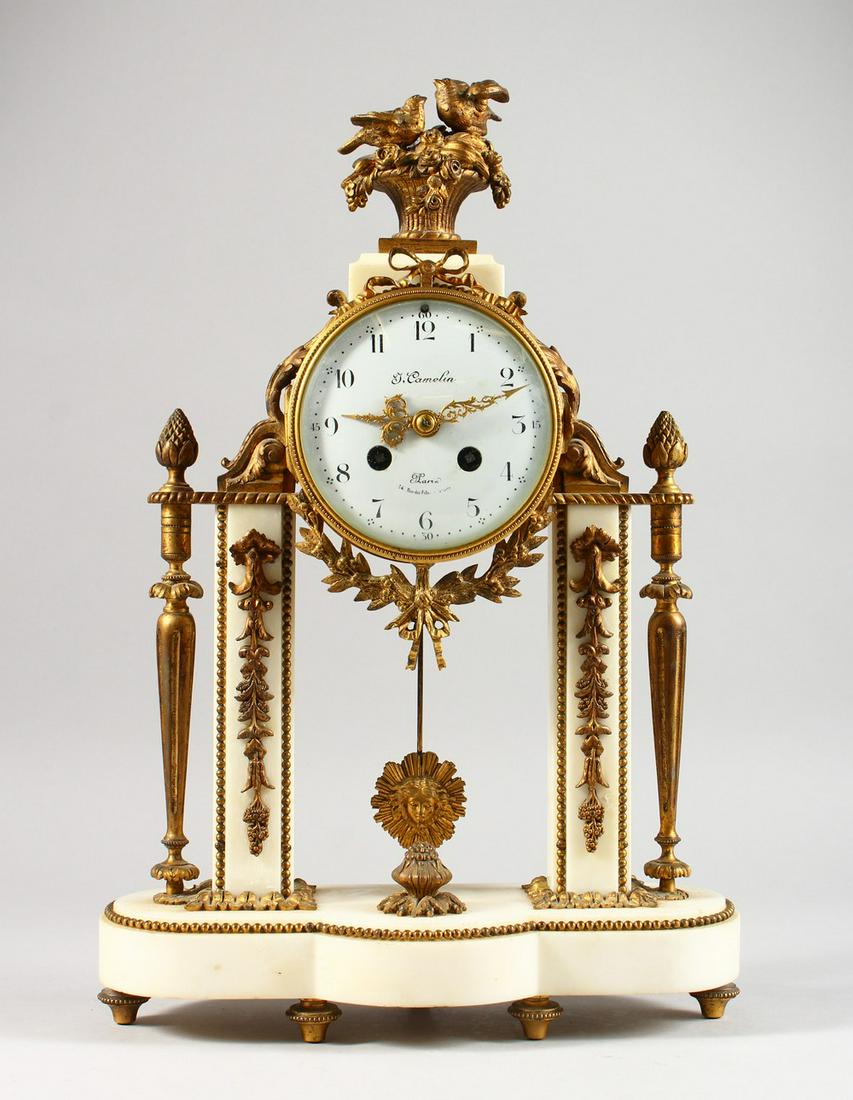 A LOUIS XVI ORMOLU AND WHITE MARBLE DAUM CLOCK by T.: A LOUIS XVI ORMOLU AND WHITE MARBLE DAUM CLOCK by T. COMELIN, PARIS, with eight-day movement, white enamel dial, striking on a single bell, the case with pineapple finial and birds nest with birds. 17