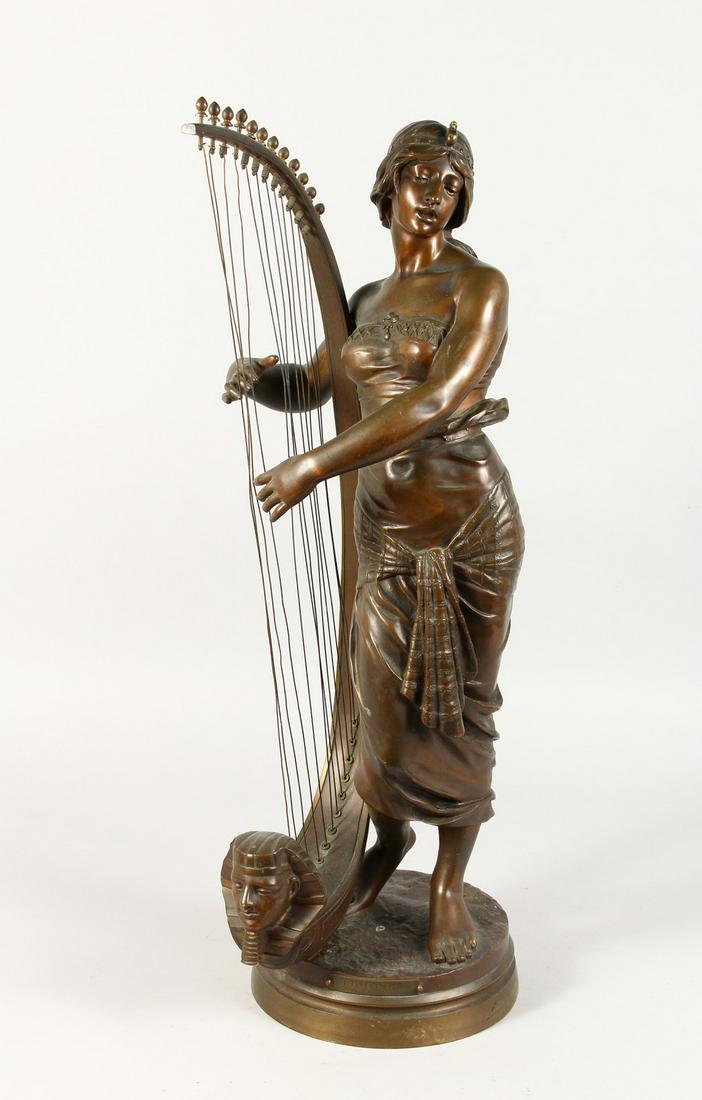 GEORGE CHARLES COUDRAY (1883-1932) FRENCH A SUPERB: GEORGE CHARLES COUDRAY (1883-1932) FRENCH A SUPERB BRONZE OF A YOUNG LADY with a harp, on a circular base. Signed. 2ft 2ins high.