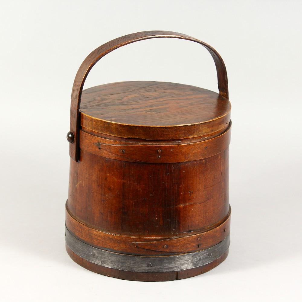A SCANDINAVIAN PINE FOOD BUCKET, with lid and handle.: A SCANDINAVIAN PINE FOOD BUCKET, with lid and handle. 9.5ins high.