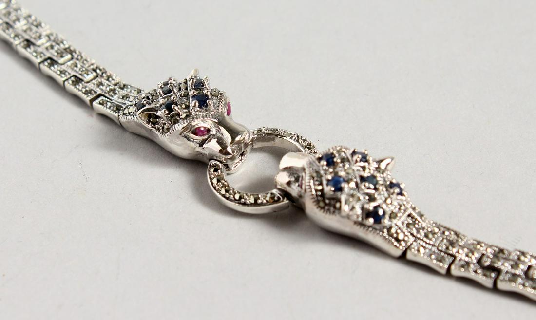 A SILVER SAPPHIRE SET PANTHER BRACELET.: A SILVER SAPPHIRE SET PANTHER BRACELET.