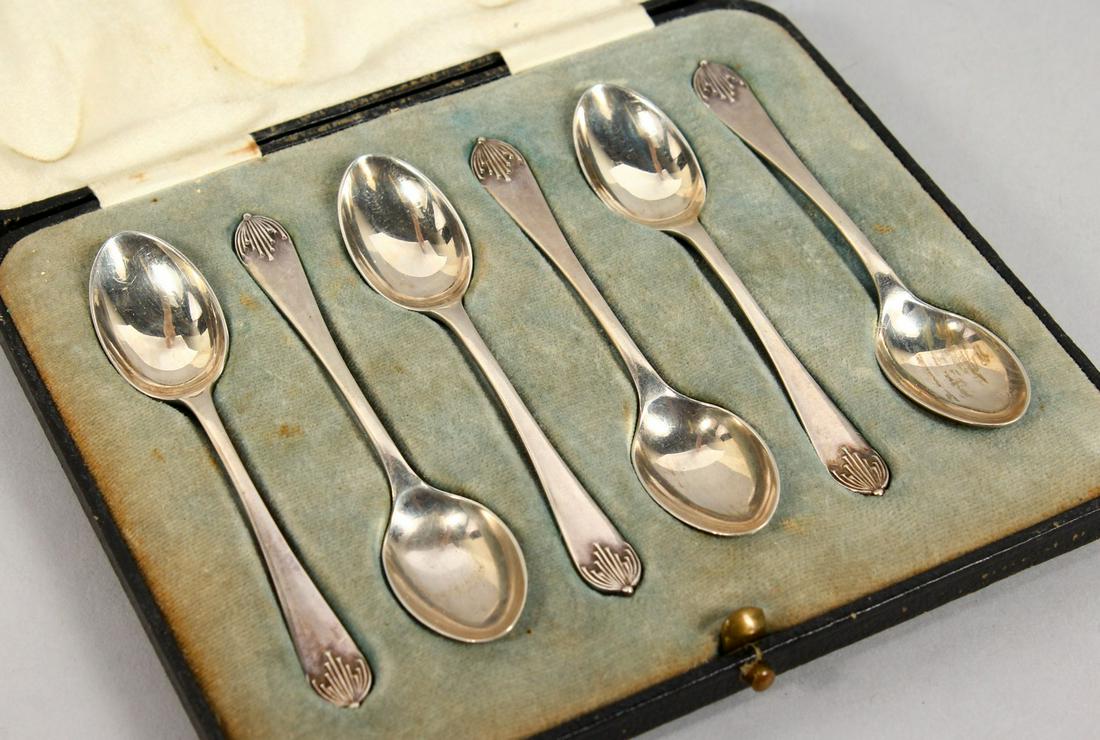 A SET OF SIX SILVER COFFEE SPOONS, cased. Walker &: A SET OF SIX SILVER COFFEE SPOONS, cased. Walker & Hall, Sheffield 1934.