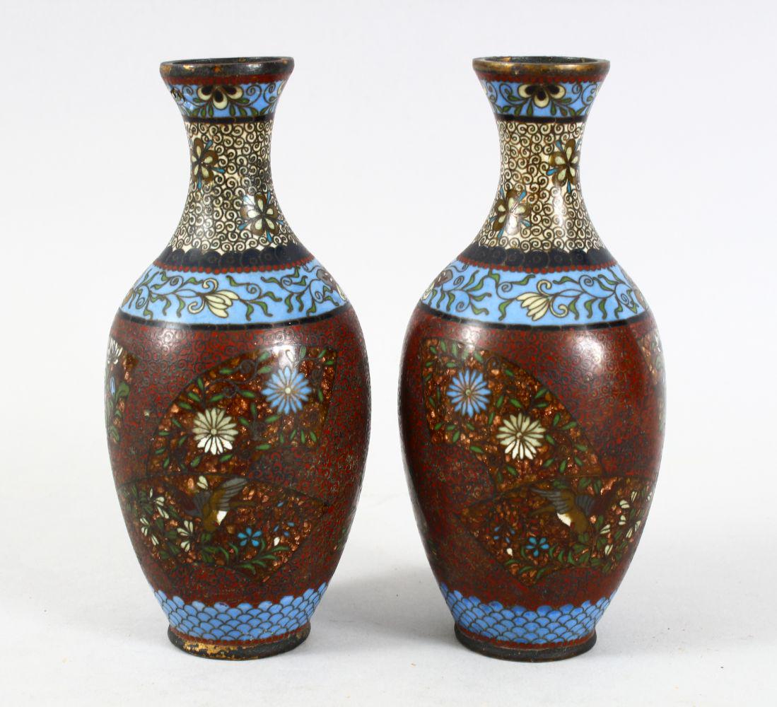 A PAIR OF JAPANESE MEIJI PERIOD CLOISIONNE VASES, both: A PAIR OF JAPANESE MEIJI PERIOD CLOISIONNE VASES, both decorated with gold speck fan panels with birds, butterflies and flora, 15.5cm high.